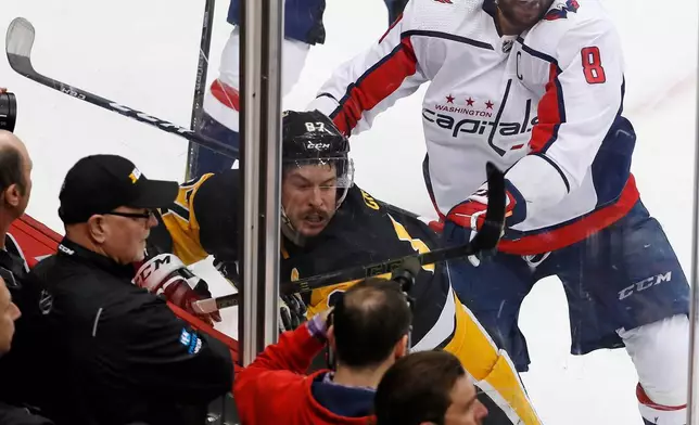 FILE - Washington Capitals' Alex Ovechkin (8) cross checks Pittsburgh Penguins' Sidney Crosby (87) during the second period in Game 3 of an NHL second-round hockey playoff series in Pittsburgh, Tuesday, May 1, 2018. (AP Photo/Gene J. Puskar, File)
