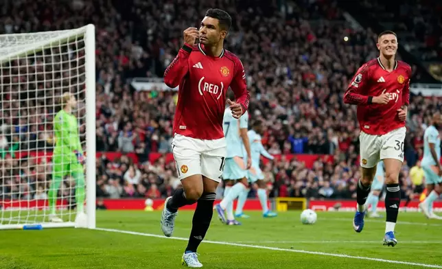 Manchester United's Casemiro celebrates after scoring during the Premier League soccer match between Manchester United and Brentford in Manchester, England, Monday, April 27, 2026. (AP Photo/Dave Thompson)