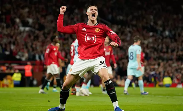 Manchester United's Benjamin Sesko celebrates after scoring during the Premier League soccer match between Manchester United and Brentford in Manchester, England, Monday, April 27, 2026. (AP Photo/Dave Thompson)