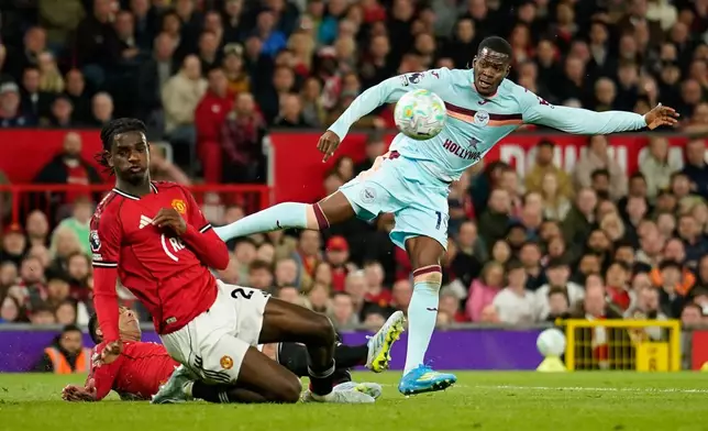 Brentford's Dango Ouattara shoots during the Premier League soccer match between Manchester United and Brentford in Manchester, England, Monday, April 27, 2026. (AP Photo/Dave Thompson)
