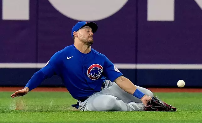 Chicago Cubs left fielder Michael Conforto can't make the catch on a single by Tampa Bay Rays' Jonathan Aranda during the eighth inning of a baseball game Wednesday, April 8, 2026, in St. Petersburg, Fla. (AP Photo/Chris O'Meara)