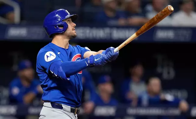 Chicago Cubs' Michael Conforto watches his two-run double off Tampa Bay Rays pitcher Joe Boyle during the fifth inning of a baseball game Wednesday, April 8, 2026, in St. Petersburg, Fla. (AP Photo/Chris O'Meara)