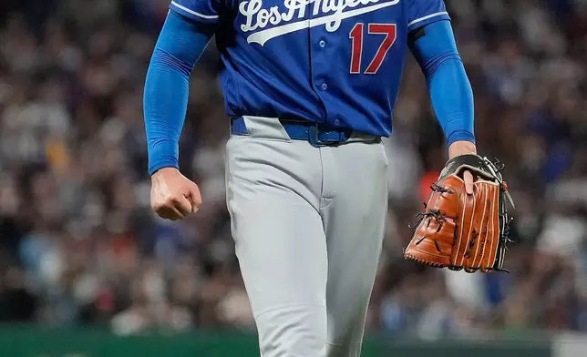 Los Angeles Dodgers pitcher Shohei Ohtani reacts after striking out San Francisco Giants' Casey Schmitt during the sixth inning of a baseball game Wednesday, April 22, 2026, in San Francisco. (AP Photo/Tony Avelar)
