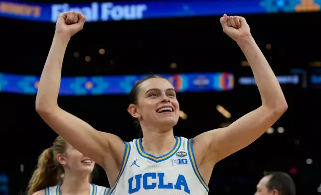 UCLA guard Gabriela Jaquez (11) celebrates after UCLA defeated Texas in a women's NCAA college basketball tournament semifinal game at the Final Four, Friday, April 3, 2026, in Phoenix. (AP Photo/Ross D. Franklin)