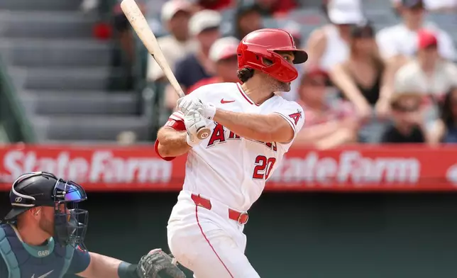 Los Angeles Angels' Adam Frazier follows through on an RBI single during the fifth inning of a baseball game against the Seattle Mariners, Sunday, April 5, 2026, in Anaheim, Calif. (AP Photo/Jessie Alcheh)