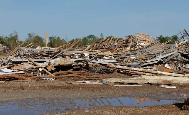 Buildings lie in shreds in Enid, Okla., Friday, April 24, 2026, in the aftermath of a tornado that barreled through Oklahoma Thursday. (AP Photo/Alonzo Adams)