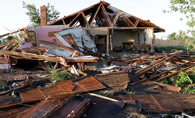 A view of a damaged home in Enid, Okla., Friday, April 24, 2026, in the aftermath of a tornado that barreled through Oklahoma Thursday. (AP Photo/Alonzo Adams)