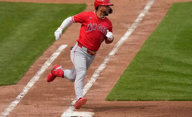 Los Angeles Angels' Oswald Peraza rounds first base after hitting a solo home run in the fourth inning of a baseball game against the Cincinnati Reds in Cincinnati, Sunday, April 12, 2026. (AP Photo/Carolyn Kaster)