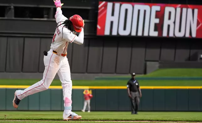 Cincinnati Reds' Elly de la Cruz celebrates as he rounds the bases after hitting a three-run homer during the ninth inning of a baseball game against the Los Angeles Angels in Cincinnati, Sunday, April 12, 2026. (AP Photo/Carolyn Kaster)