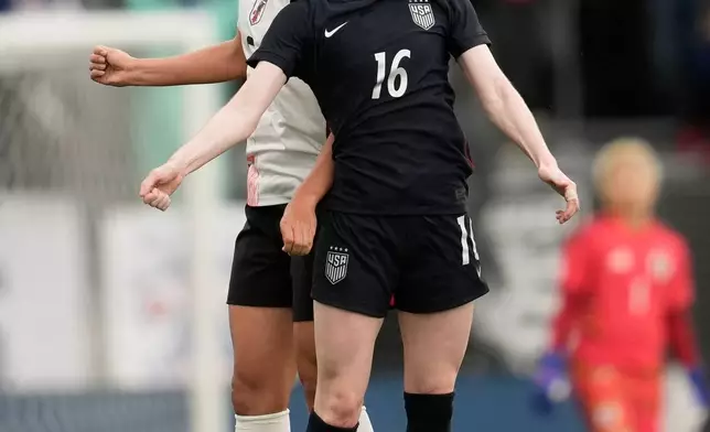The United States' Rose Lavelle (16) jumps for the ball against Japan's Toko Koga during the first half of an international friendly soccer match Saturday, April 11, 2026, in San Jose, Calif. (AP Photo/Jeff Chiu)