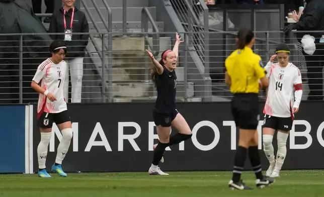 The United States' Rose Lavelle, middle, celebrates after scoring against Japan during the first half of an international friendly soccer match Saturday, April 11, 2026, in San Jose, Calif. (AP Photo/Jeff Chiu)