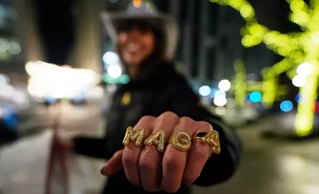 FILE - Alicia DeVinney of Phoenixville, Pa., shows off her MAGA rings ahead of the 60th Presidential Inauguration, Jan. 19, 2025, in Washington. (AP Photo/Mike Stewart, File)