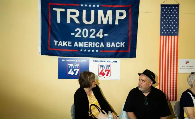 FILE - Attendees gather as the "Latino Americans for Trump" office opens in Reading, Pa., Wednesday, June 12, 2024. (AP Photo/Joe Lamberti)