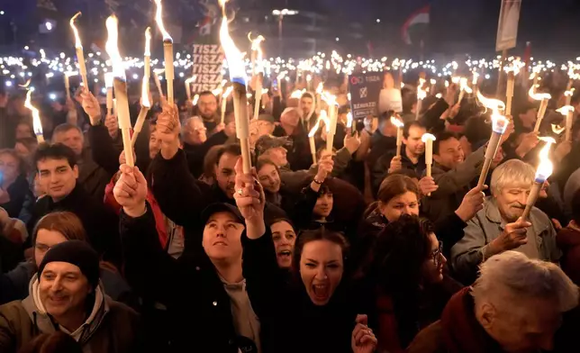 Supporters attend a final election rally of Peter Magyar, the leader of the opposition Tisza party in Debrecen, Hungary, Saturday, April 11, 2026. (AP Photo/Darko Bandic)