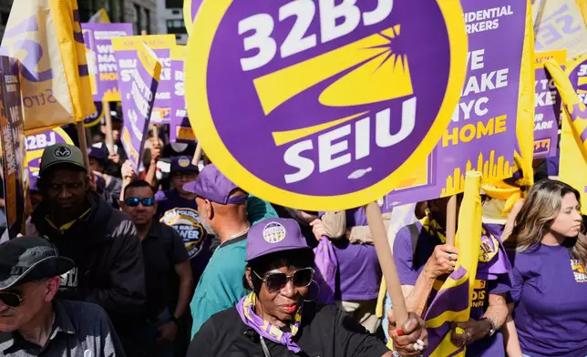 Members of the 32BJ SEIU union and their supporters rally on Park Avenue, in New York, Wednesday, April 15, 2026. (AP Photo/Seth Wenig)