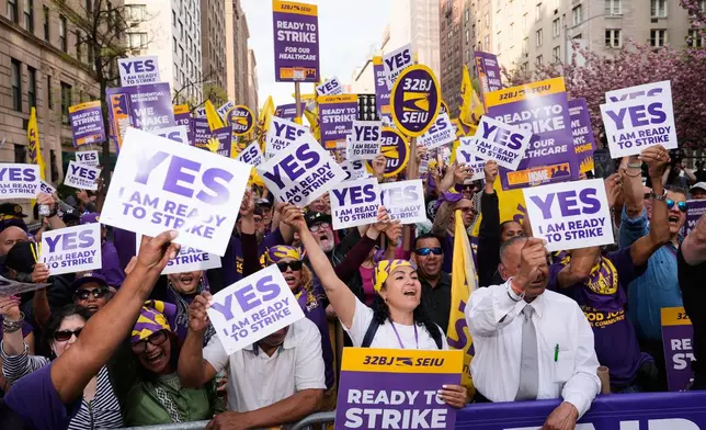 Members of the 32BJ SEIU union vote to authorize a strike during a rally on Park Avenue, in New York, Wednesday, April 15, 2026. (AP Photo/Seth Wenig)