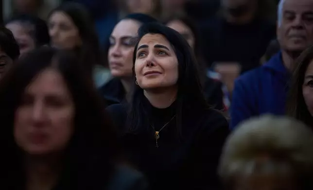 Worshipers pray during Good Friday Mass at St. Anthony Church, which was devoted to expressing solidarity with Christian villagers in southern Lebanon displaced by the war in Jdeideh, a suburb of Beirut, Lebanon, Friday, April 3, 2026. (AP Photo/Emilio Morenatti)