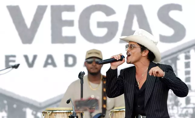 Bruno Mars performs for fans in Toshiba Plaza after a parade down the Las Vegas Strip Friday, April 10, 2026, in Las Vegas, on "Bruno Mars Day." (Steve Marcus/Las Vegas Sun via AP)