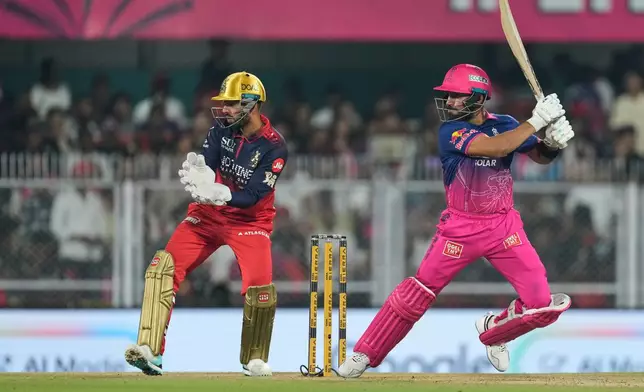 Rajasthan Royals' Dhruv Jurel hits a boundary during the Indian Premier League cricket match between Royal Challengers Bengaluru and Rajasthan Royals in Guwahati, India, Friday, April 10, 2026. (AP Photo/Anupam Nath)