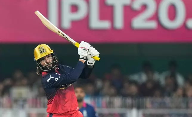 Royal Challengers Bengaluru's captain Rajat Patidar hits a six during the Indian Premier League cricket match between Royal Challengers Bengaluru and Rajasthan Royals in Guwahati, India, Friday, April 10, 2026. (AP Photo/Anupam Nath)