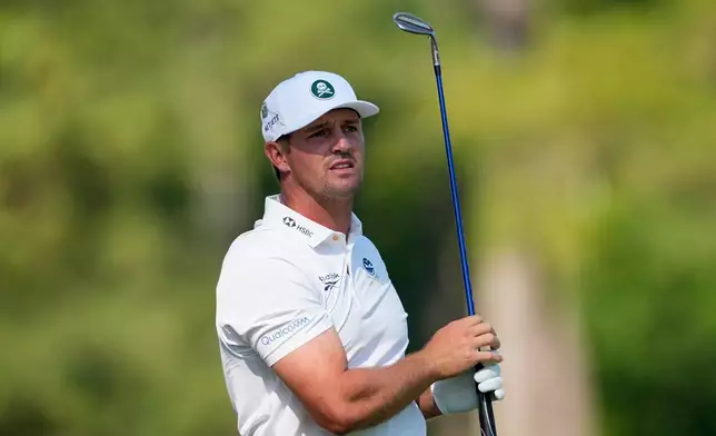 Bryson DeChambeau watches his tee shot on the 12th hole during the second round of the Masters golf tournament at the Augusta National Golf Club, Friday, April 10, 2026, in Augusta, Ga. (AP Photo/Eric Gay)