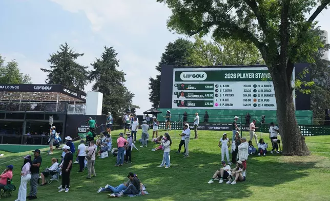 Fans wait for players at 18th hole during the first round of the LIV Golf tournament in Naucalpan on the outskirts of Mexico City, Thursday, April 16, 2026. (AP Photo/Fernando Llano)