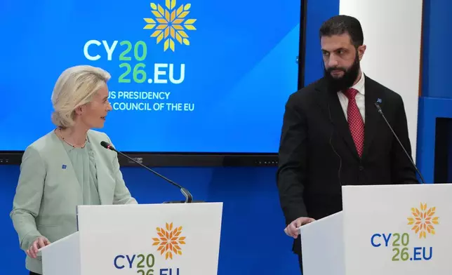 European Commission President Ursula von der Leyen, left, and Syrian President Ahmad al-Sharaa join a press conference after the EU Summit in Nicosia, Cyprus, Friday, April 24, 2026. (AP Photo/Petros Karadjias)