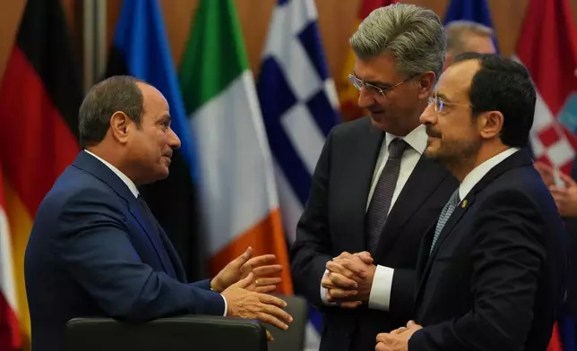 Egypt's President Abdel-Fattah el-Sissi, left, Cypriot President Nikos Christodoulides, right, and Croatia's Prime Minister Andrej Plenkovic talk during the EU Summit in Nicosia, Cyprus, Friday, April 24, 2026. (AP Photo/Petros Karadjias)