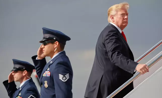 FILE - President Donald Trump boards Air Force One during his departure from Andrews Air Force One Base, Md., April 28, 2018. Trump traveled to Michigan to speak at a rally on the same night as the White House Correspondent's Dinner, the second straight year Trump as skipped the event with the White House Press Corps. (AP Photo/Pablo Martinez Monsivais, File)