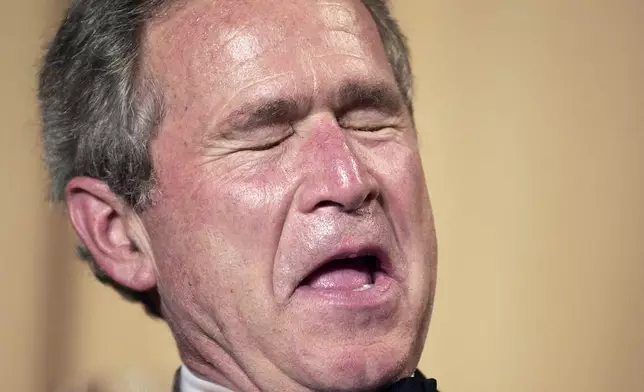 FILE - President George W. Bush laughs as comedian Jay Leno tells jokes at the annual White House Correspondents Association Dinner in Washington, on May 1, 2004. (AP Photo/Gerald Herbert, File)