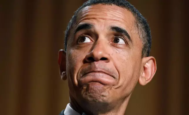 FILE - President Barack Obama makes a face as they show his video during his speech at the White House Correspondents' Association Dinner in Washington, April 30, 2011. (AP Photo/Manuel Balce Ceneta, File)
