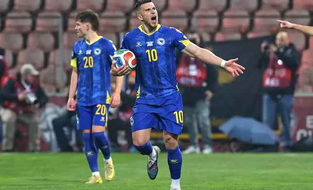 Bosnia's Ermedin Demirovic celebrates after Bosnia's Haris Tabakovic scored his side's first goal during the World Cup qualifying playoff final soccer match between Bosnia and Italy in Zenica, Bosnia, Tuesday, March 31, 2026. (AP Photo/Armin Durgut)