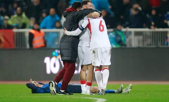 Turkey's players celebrate after winning the World Cup qualifying playoff final soccer match between Kosovo and Turkey in Pristina, Kosovo, Tuesday, March 31, 2026. (AP Photo/Visar Kryeziu)