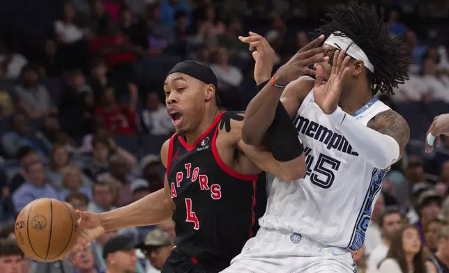 Toronto Raptors forward Scottie Barnes (4) dribbles while defended by Memphis Grizzlies forward GG Jackson II, right, during the first half of an NBA basketball game Friday, April 3, 2026, in Memphis, Tenn. (AP Photo/Nikki Boertman)