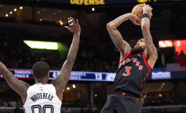 Toronto Raptors forward Brandon Ingram (3) looks to shoot while defended by Memphis Grizzlies forward Dariq Whitehead (00) during the first half of an NBA basketball game Friday, April 3, 2026, in Memphis, Tenn. (AP Photo/Nikki Boertman)