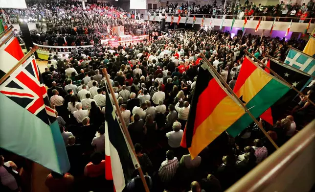 FILE - People attend a ceremony commemorating the final speech of Rev. Martin Luther King Jr. at the Mason Temple of the Church of God in Christ, Tuesday, April 3, 2018, in Memphis, Tenn. (AP Photo/Mark Humphrey, File)