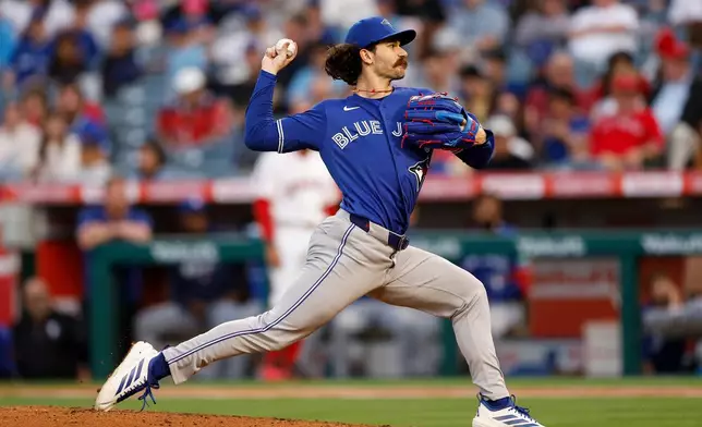 Toronto Blue Jays starting pitcher Dylan Cease delivers during the second inning of a baseball game against the Los Angeles Angels, Monday, April 20, 2026, in Anaheim, Calif. (AP Photo/Caroline Brehman)
