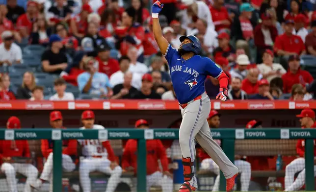 Toronto Blue Jays' Vladimir Guerrero Jr. (27) rounds the bases after hitting a two-run home run during the third inning of a baseball game against the Los Angeles Angels, Monday, April 20, 2026, in Anaheim, Calif. (AP Photo/Caroline Brehman)