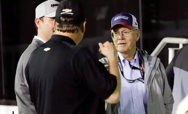 FILE - Jim France, right, chairman and executive vice president of NASCAR, talks with sponsors in Victory Lance after the second of two NASCAR Daytona 500 qualifying auto races at Daytona International Speedway, Thursday, Feb. 13, 2020, in Daytona Beach, Fla. (AP Photo/Terry Renna, File_