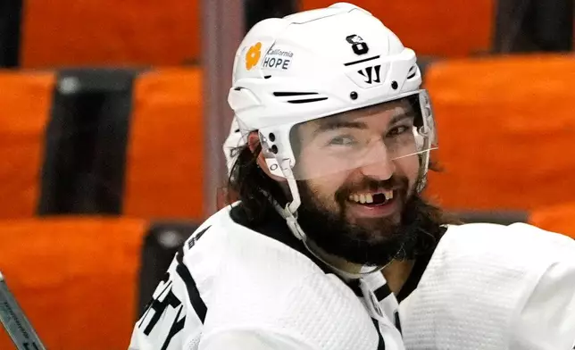 FILE - Los Angeles Kings defenseman Drew Doughty smiles after right wing Alex Iafallo scored during the third period of an NHL hockey game against the Anaheim Ducks Wednesday, March 10, 2021, in Anaheim, Calif. (AP Photo/Mark J. Terrill, File)