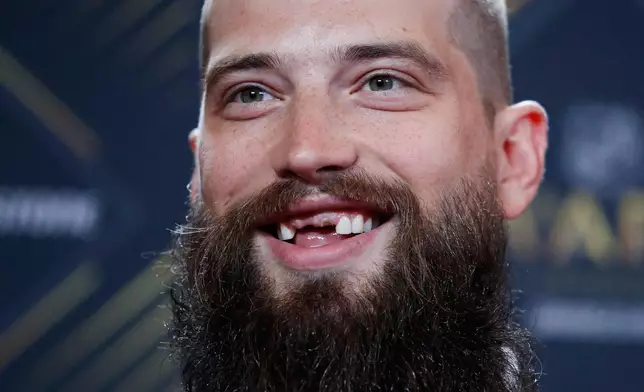 FILE - San Jose Sharks' Brent Burns smiles on the red carpet before the NHL Awards, Wednesday, June 19, 2019, in Las Vegas. (AP Photo/John Locher, File)