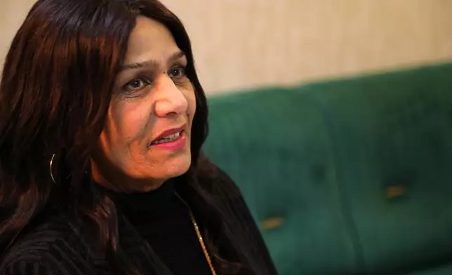 FILE - Singer Sajda Obeid speaks during an interview in Irbil, Iraq, Friday, Dec. 10, 2021. (AP Photo/Hussein Ibrahim, File)