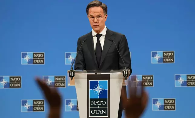 NATO Secretary General Mark Rutte takes questions from journalists during the launch of the NATO Secretary General's Annual Report for 2025 at NATO headquarters in Brussels, Thursday, March 26, 2026. (AP Photo/Virginia Mayo)
