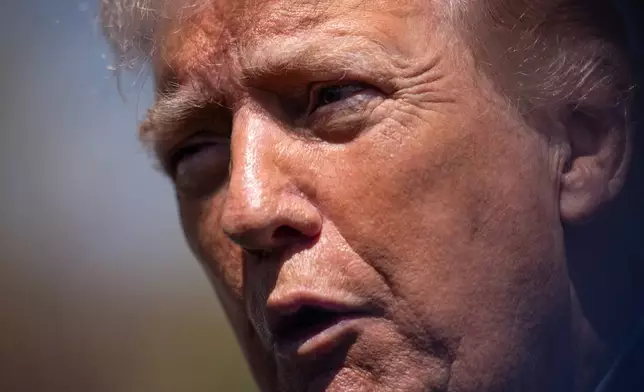 President Donald Trump speaks with reporters during the White House Easter Egg Roll on the South Lawn of the White House, Monday, April 6, 2026, in Washington. (AP Photo/Julia Demaree Nikhinson)