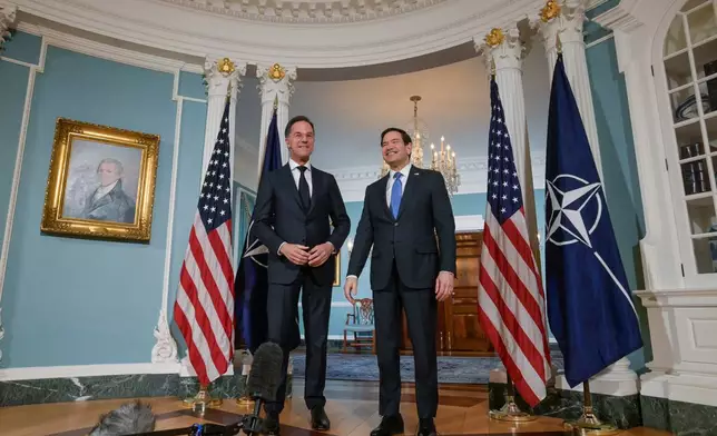 Secretary of State Marco Rubio, right, is joined by NATO Secretary General Mark Rutte, left, for a photo opportunity at the State Department, Wednesday, April 8, 2026, in Washington. (AP Photo/Rod Lamkey, Jr.)