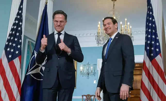 Secretary of State Marco Rubio, right, is joined by NATO Secretary General Mark Rutte, left, for a photo opportunity at the State Department, Wednesday, April 8, 2026, in Washington. (AP Photo/Rod Lamkey, Jr.)
