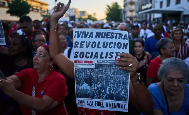 People attend a celebration marking the 65th anniversary of the proclamation declaring the Cuban Revolution socialist, in Havana, Cuba, Thursday, April 16, 2026. (AP Photo/Ramon Espinosa)