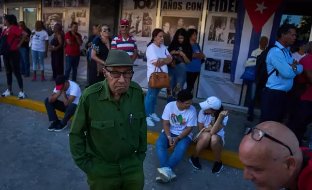People attend a celebration marking the 65th anniversary of the proclamation declaring the Cuban Revolution socialist, in Havana, Cuba, Thursday, April 16, 2026. (AP Photo/Ramon Espinosa)