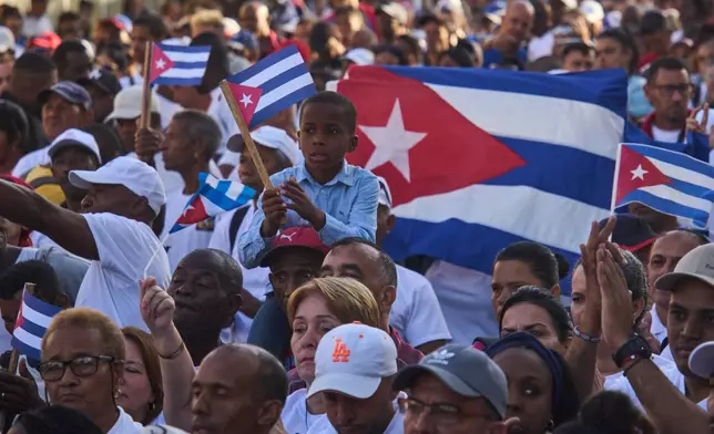 People attend a celebration marking the 65th anniversary of the proclamation declaring the Cuban Revolution socialist, in Havana, Cuba, Thursday, April 16, 2026. (AP Photo/Ramon Espinosa)