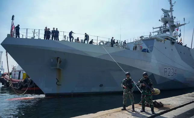FILE - Indonesian soldiers stand guard as Royal Navy offshore patrol vessel HMS Spey is docked at Tanjung Priok Port during a port visit in Jakarta, Indonesia, Wednesday, Jan. 15, 2025. (AP Photo/Tatan Syuflana, File)
